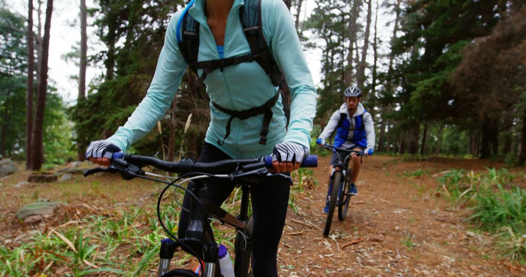 Dynamic Mountain Biking Adventure through Forest Path
