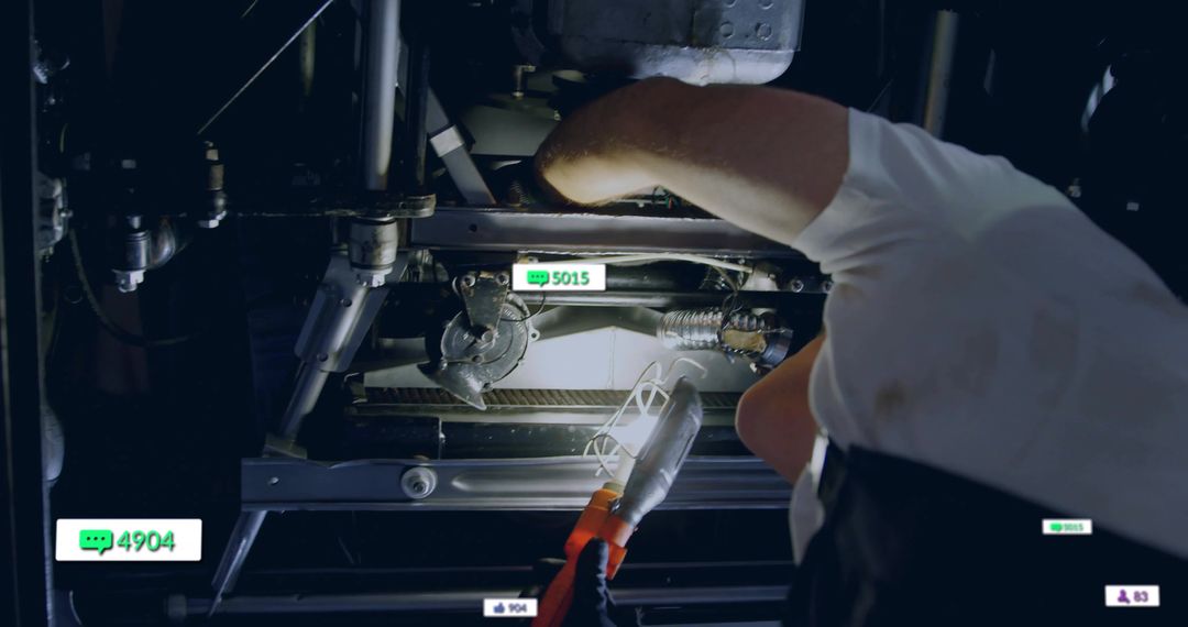 Technician Inspecting Machinery with Digital Interface Icons