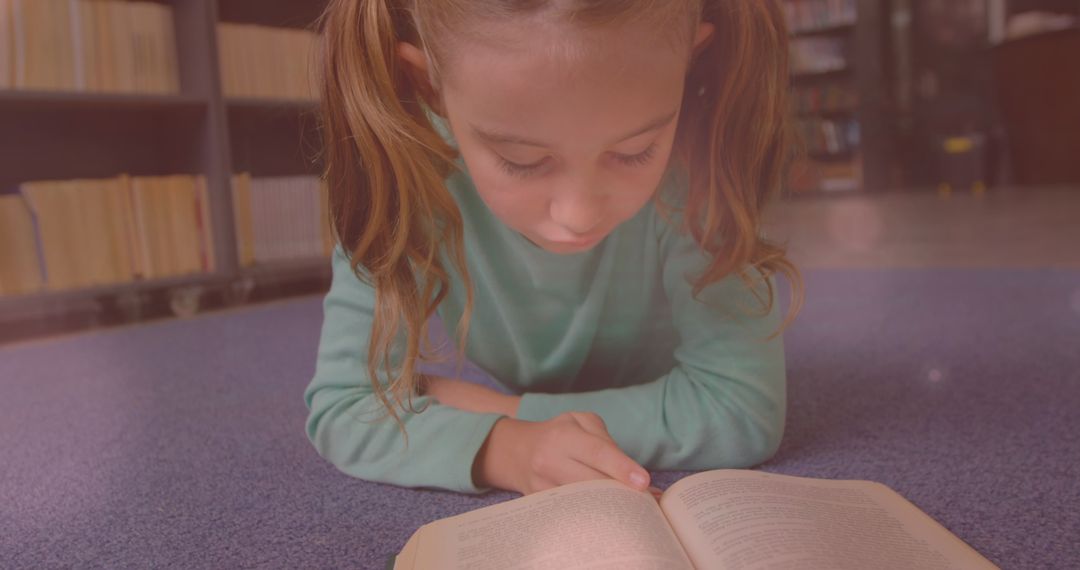 Curious Schoolgirl Immersed in Reading Book in Library