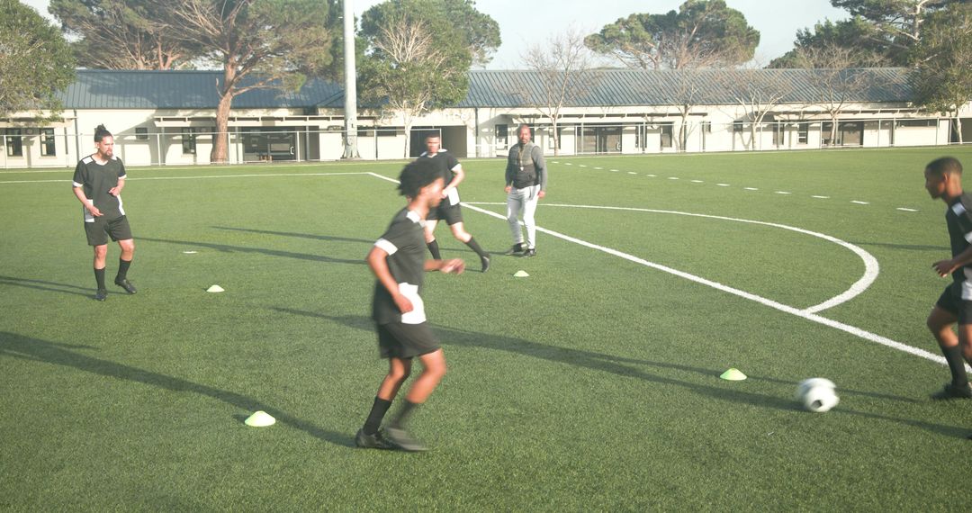 Soccer Players Practicing Passing on Field