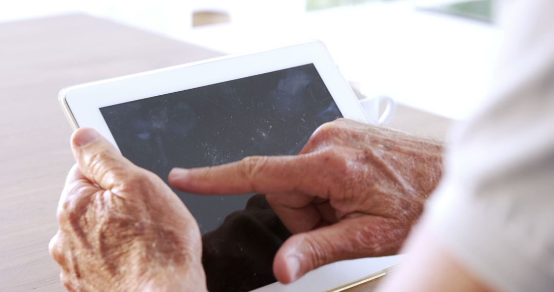 Senior Using Tablet Computer for Touchscreen Interaction - Free Images, Stock Photos and Pictures on Pikwizard.com