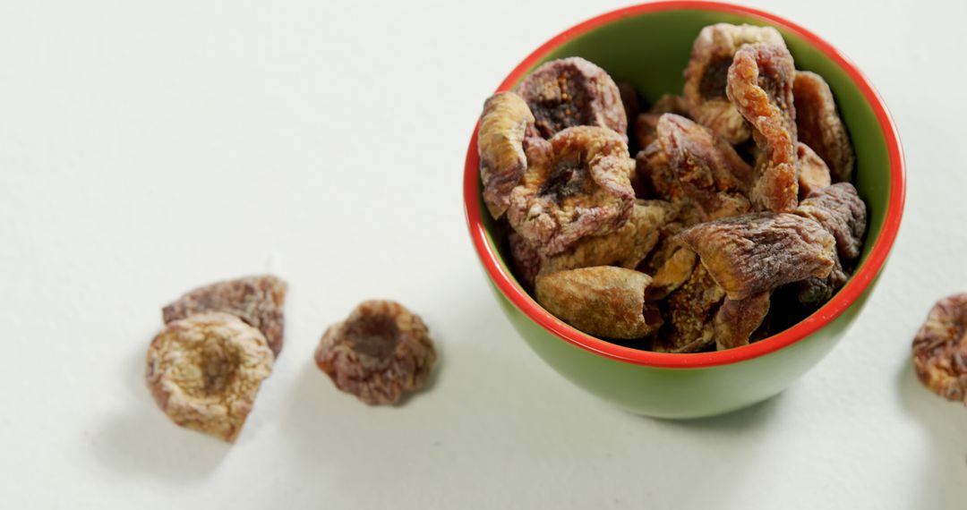 Dried Figs in Green Bowl on White Background - Free Images, Stock Photos and Pictures on Pikwizard.com