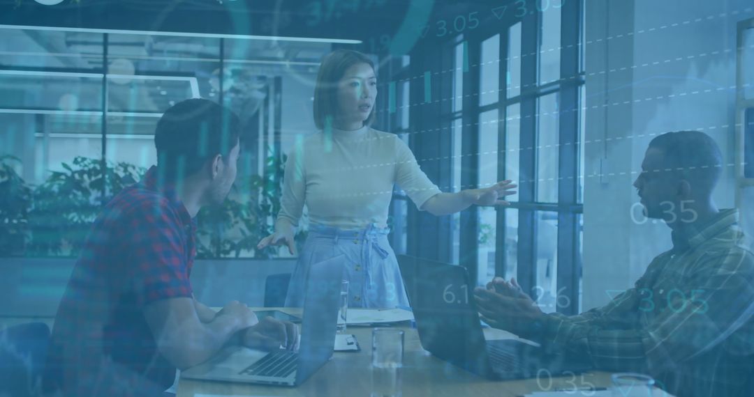 Diverse Team Analyzing Financial Data in Office with Overlay Graphics