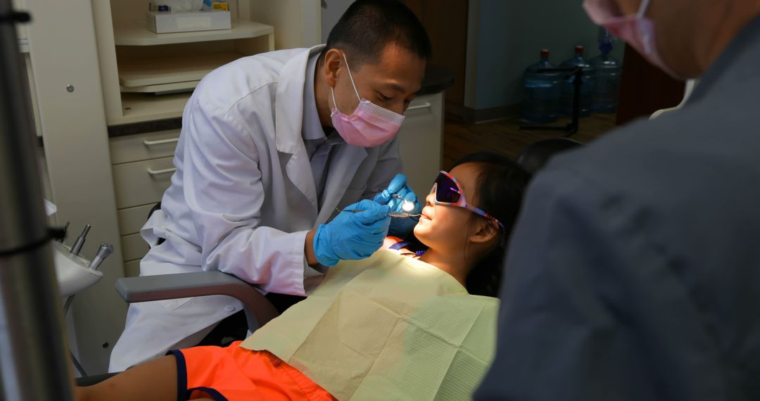 Dentist Examining Child's Teeth for Dental Check-up - Free Images, Stock Photos and Pictures on Pikwizard.com