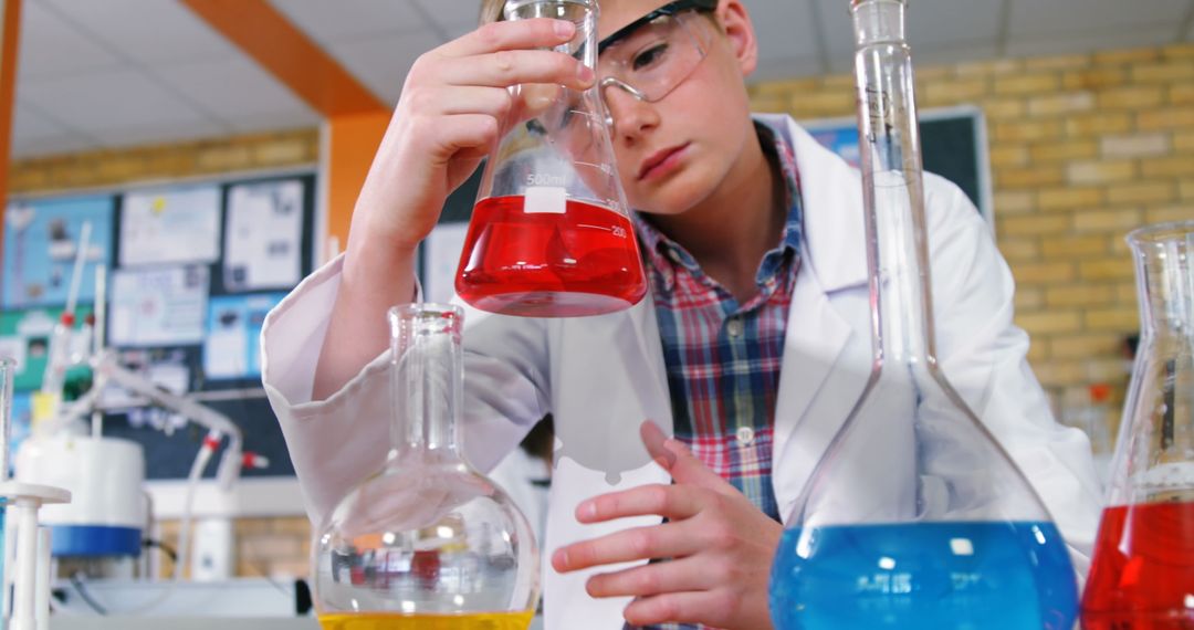 Young Scientist Experimenting in Chemistry Classroom