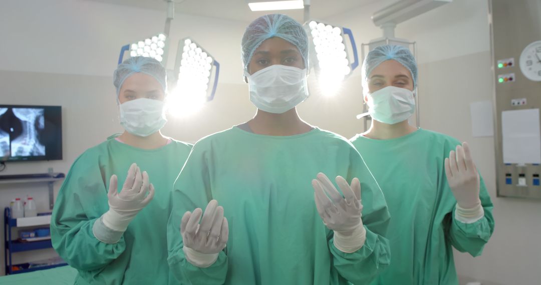 Three Surgeons Prepared for Surgery in Operating Room - Free Images, Stock Photos and Pictures on Pikwizard.com