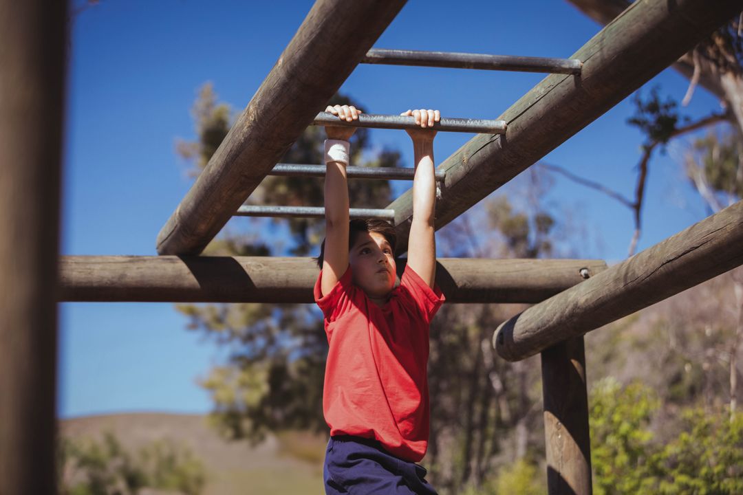 Child Engaging on Monkey Bars Playground Climbing Frame Outdoors