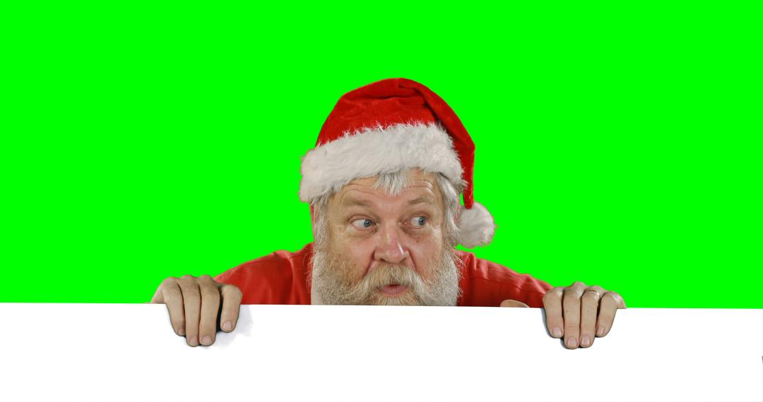 Surprised Santa Claus Peeking Over Blank Sign Board Against Green Background - Free Images, Stock Photos and Pictures on Pikwizard.com