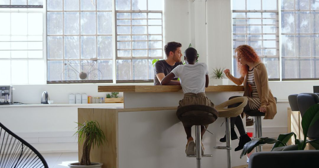 Diverse Team Enjoying Collaborative Discussion in Modern Office
