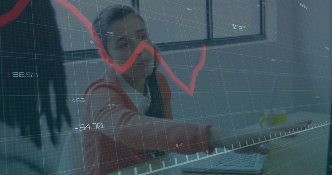 Office Professional Working on Business Analytics with Red Line Graph