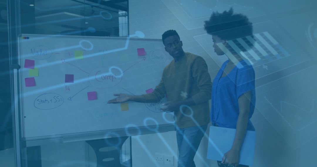 Business team collaborating at whiteboard with sticky notes and digital analytics overlay