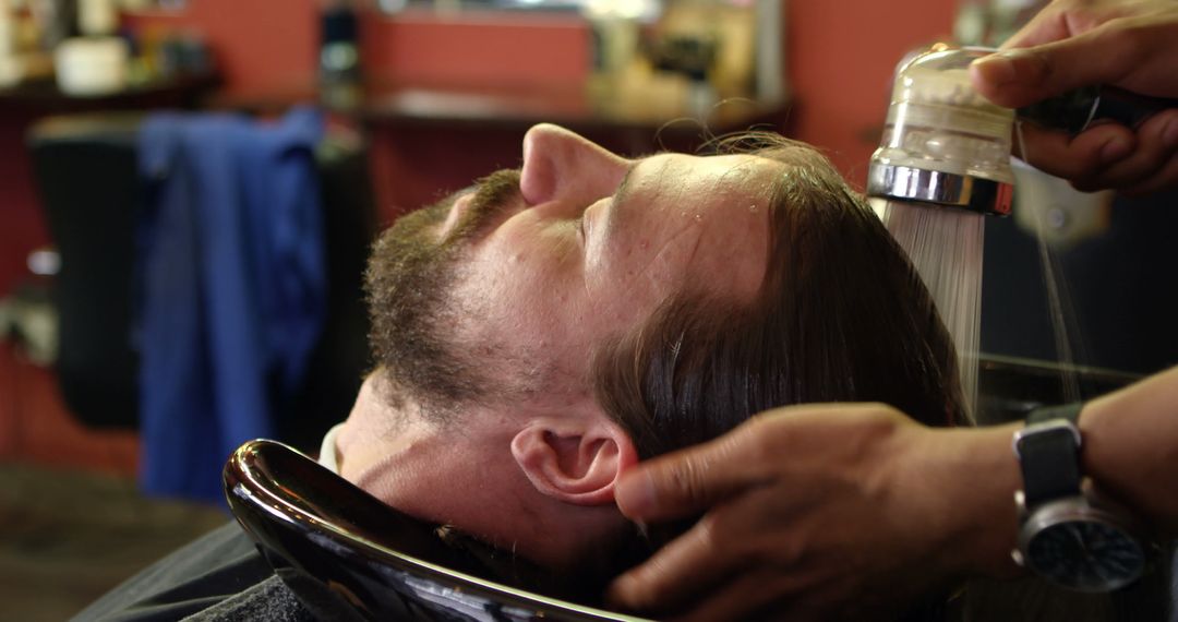 Man Receiving Hair Wash at Barber Shop - Free Images, Stock Photos and Pictures on Pikwizard.com