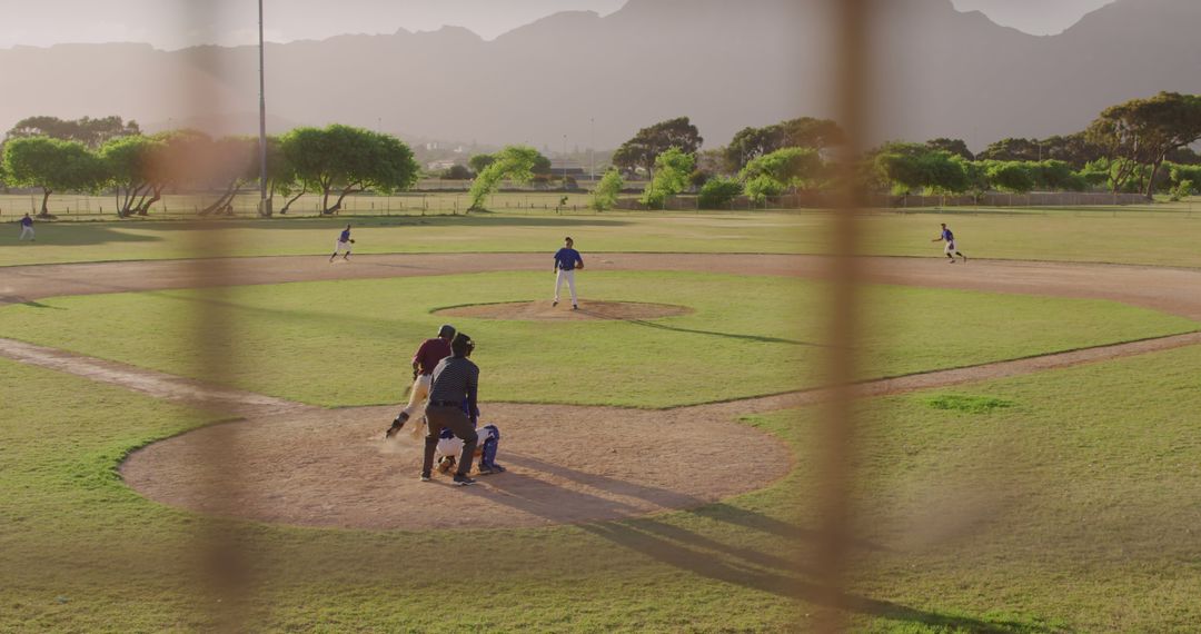 Sunny Outdoor Baseball Game with Players in Ready Positions - Free Images, Stock Photos and Pictures on Pikwizard.com