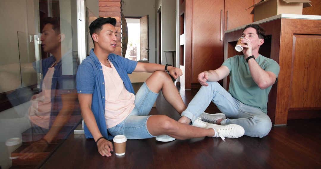 Diverse Male Couple Relaxing and Enjoying Coffee at Home
