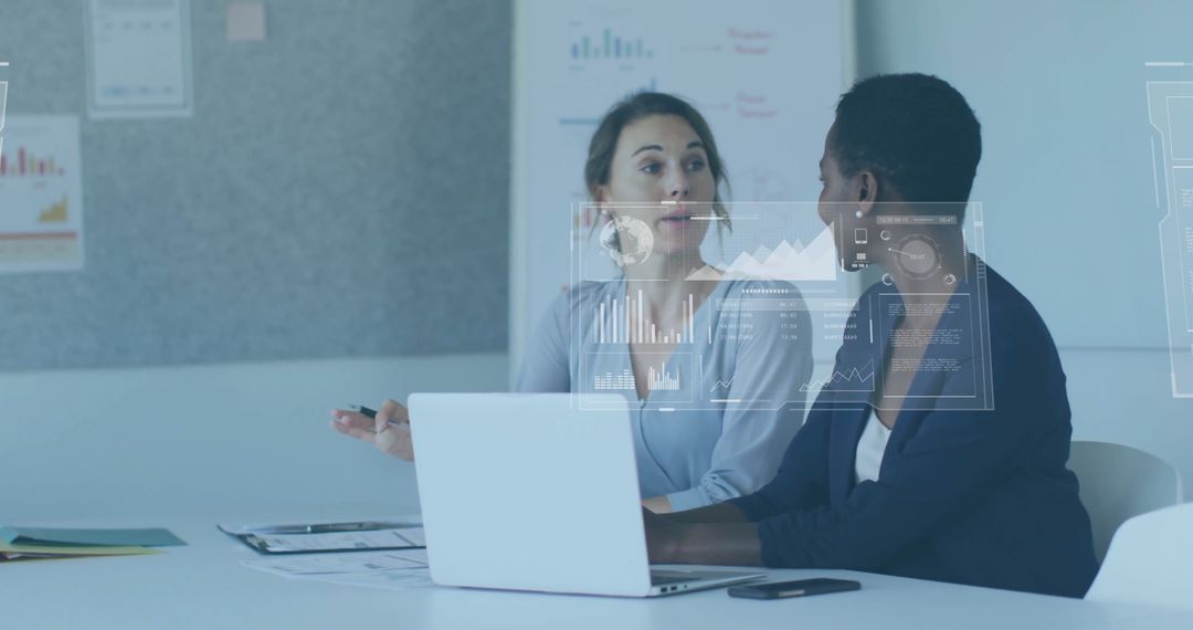 Diverse Businesswomen Engaged in Data Analysis Meeting