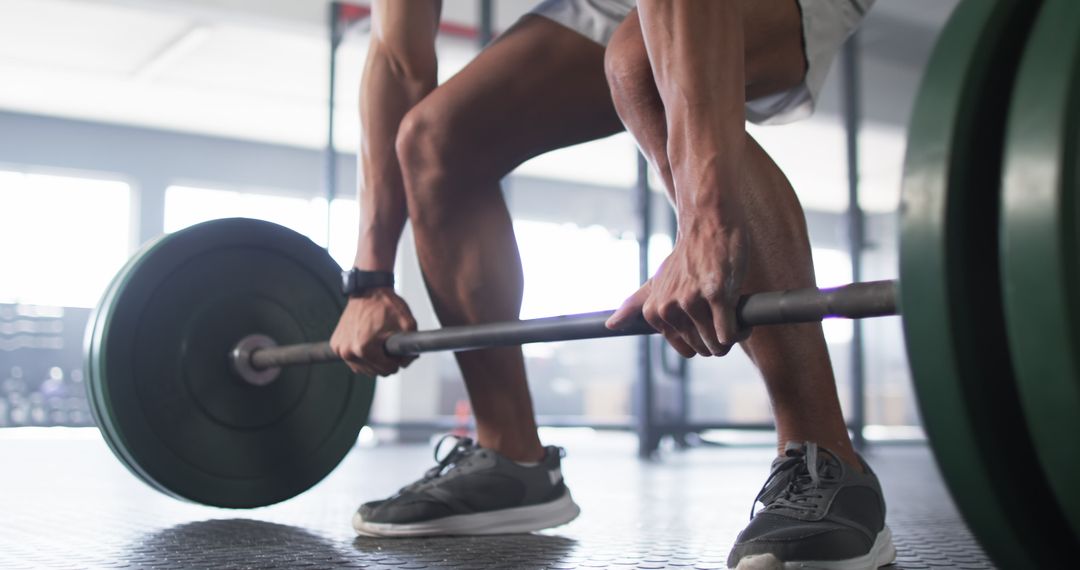 Man Performing Deadlift Exercise in Gym