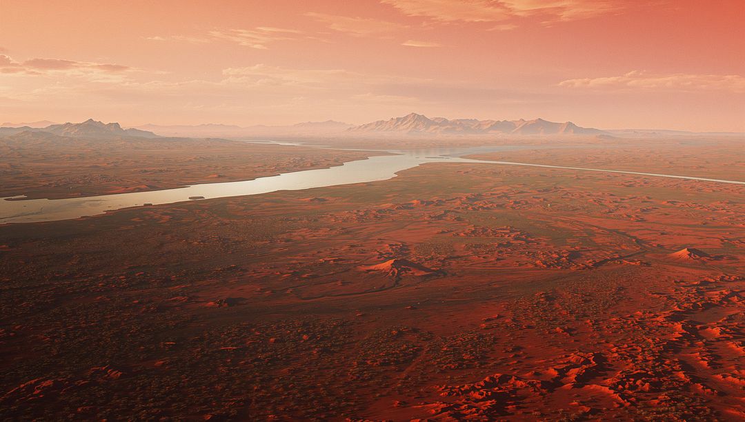 Rust-Red Desert River at Sunset, Meandering Waterway Carving Badlands and Distant Peaks