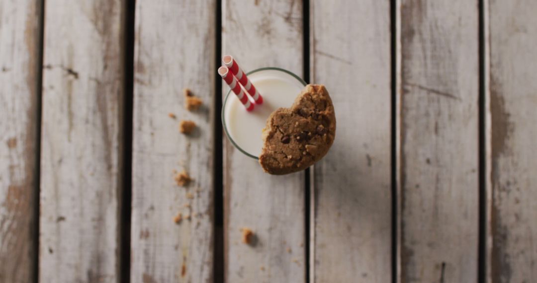 Milk and Cookie on Rustic Wooden Table with Red Straws - Free Images, Stock Photos and Pictures on Pikwizard.com