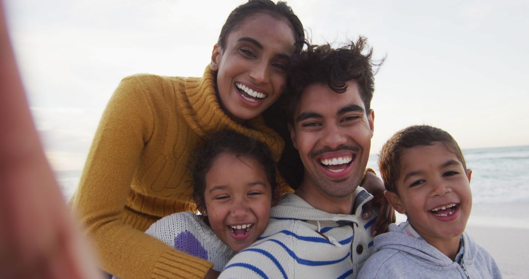 Joyful Family Taking Selfie on Beach Getaway