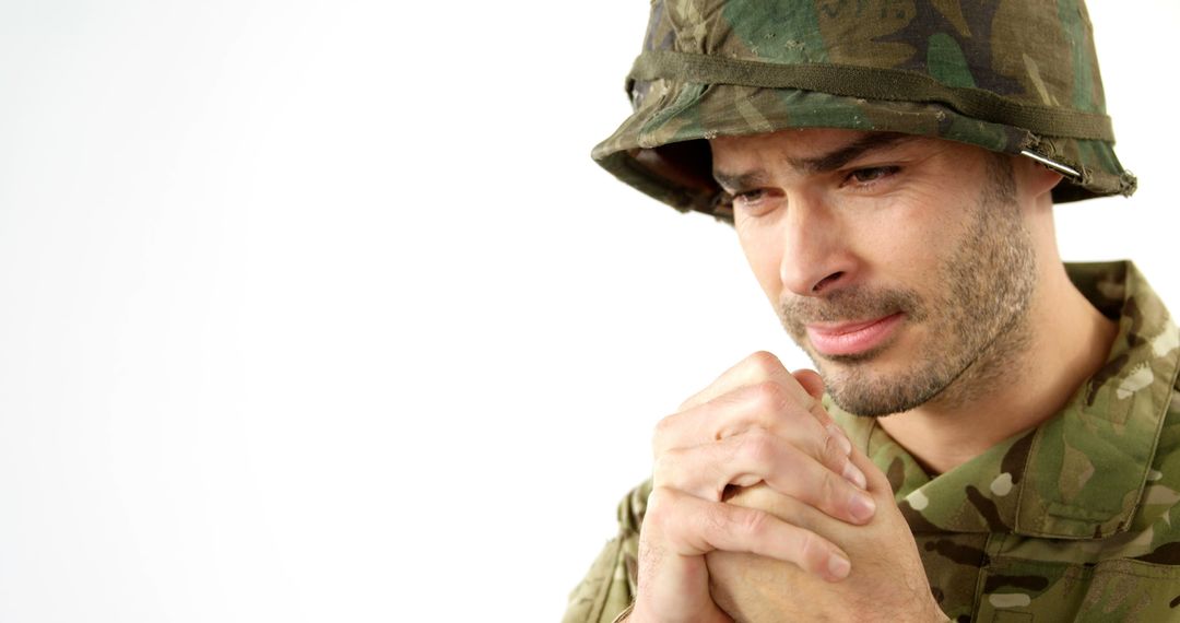 Stressed Soldier Praying in Military Uniform - Free Images, Stock Photos and Pictures on Pikwizard.com