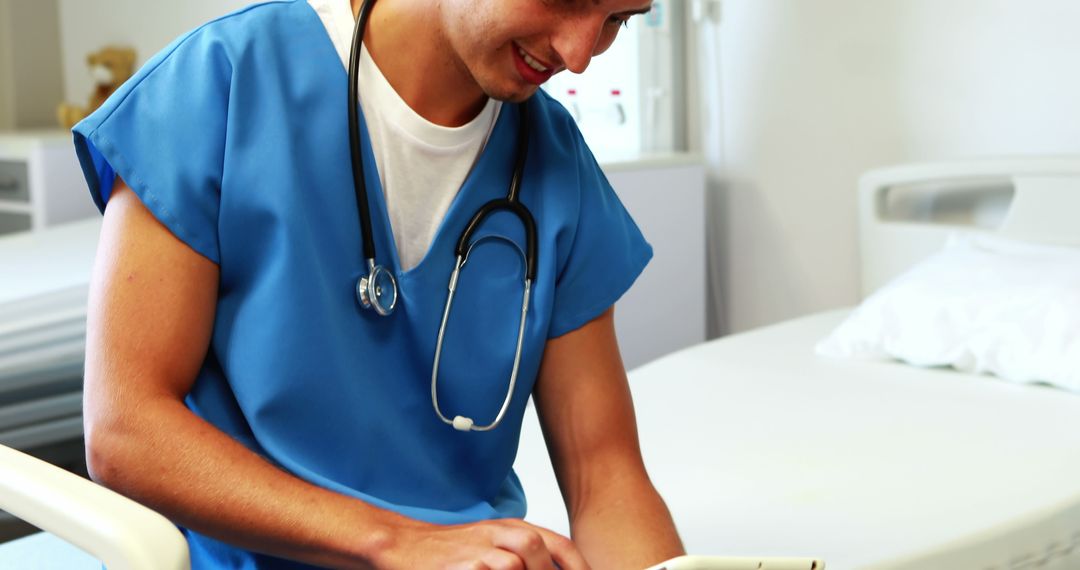 Healthcare Professional Using Tablet in Modern Hospital Room - Free Images, Stock Photos and Pictures on Pikwizard.com