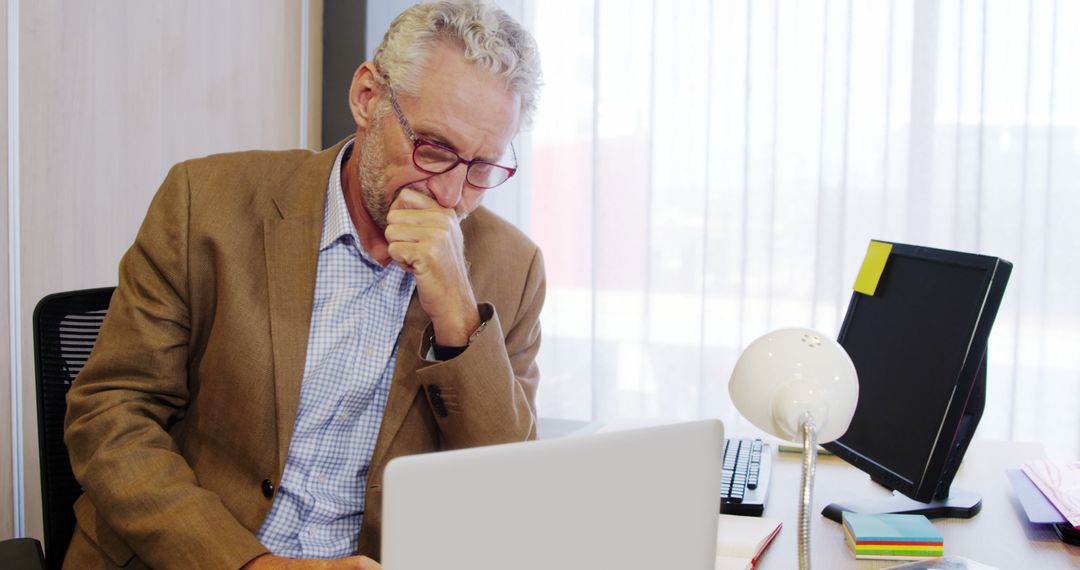 Senior Businessman Deep in Thought at Office Desk - Free Images, Stock Photos and Pictures on Pikwizard.com