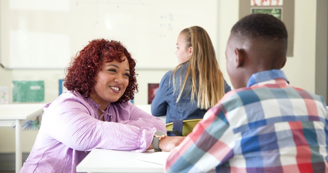 Teacher Mentoring Student in Classroom Environment