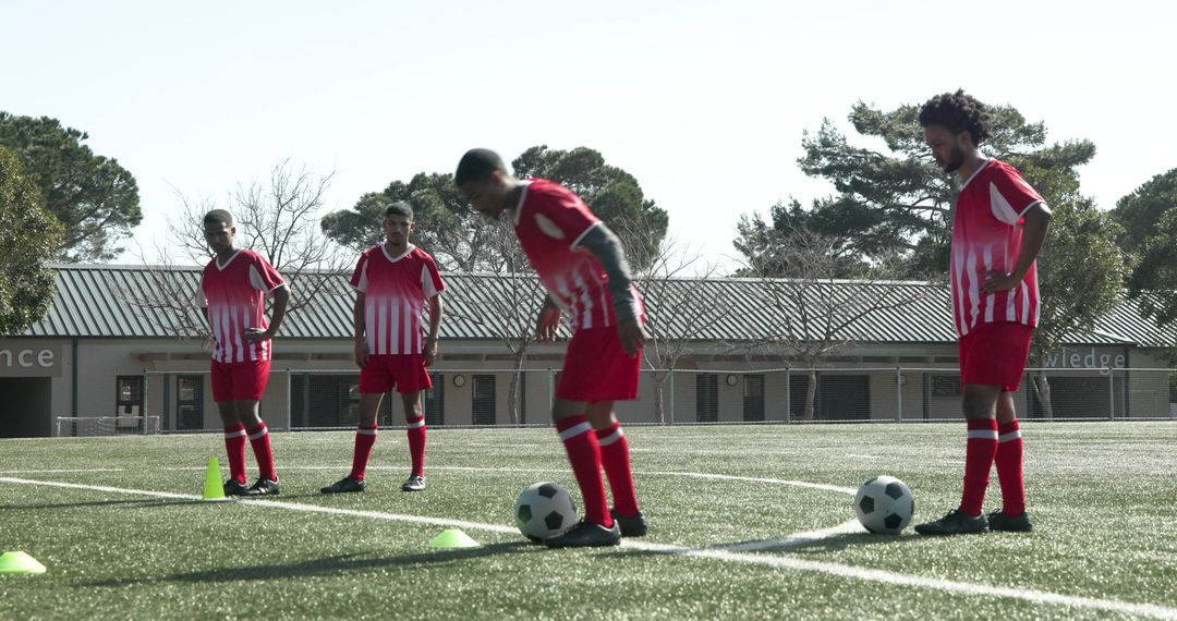 Young Soccer Players Practicing Drills on Field