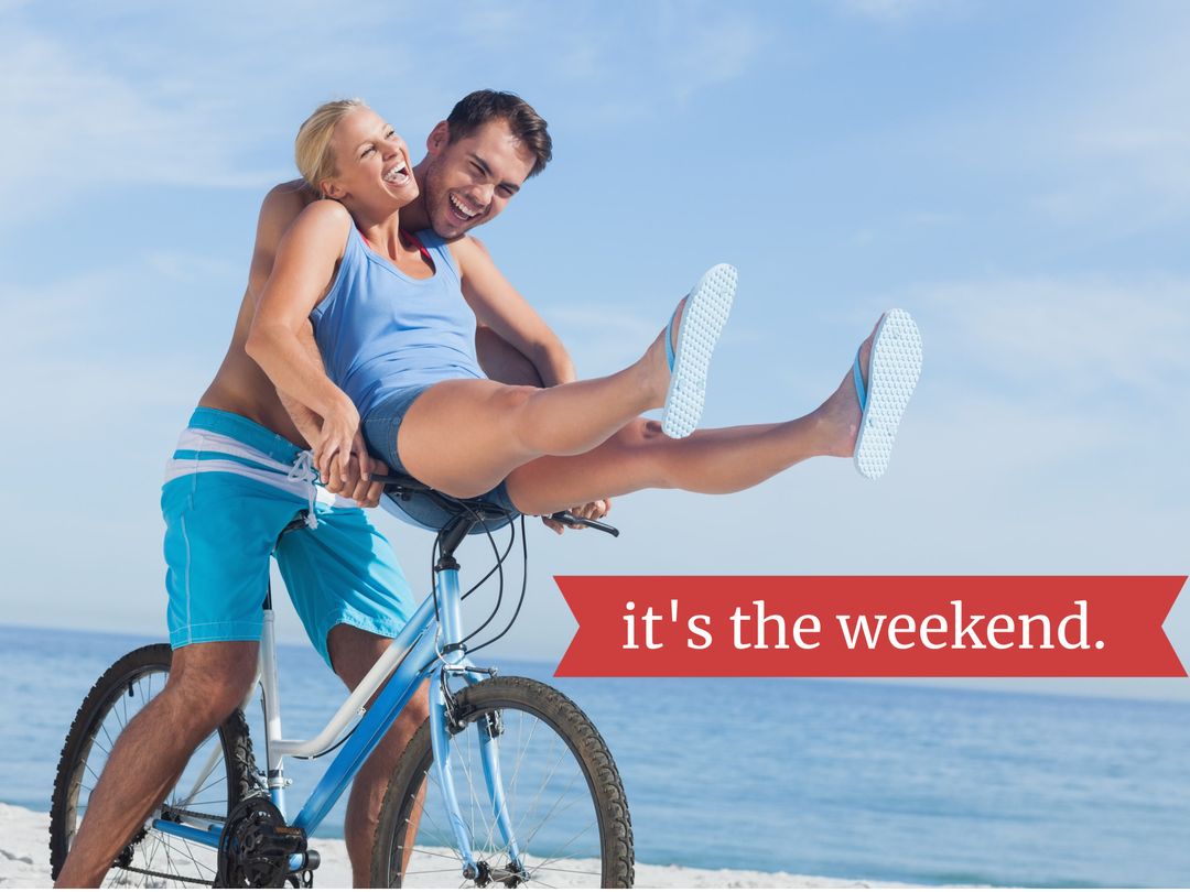 Joyful Couple Enjoying Weekend Bicycle Ride by the Sea