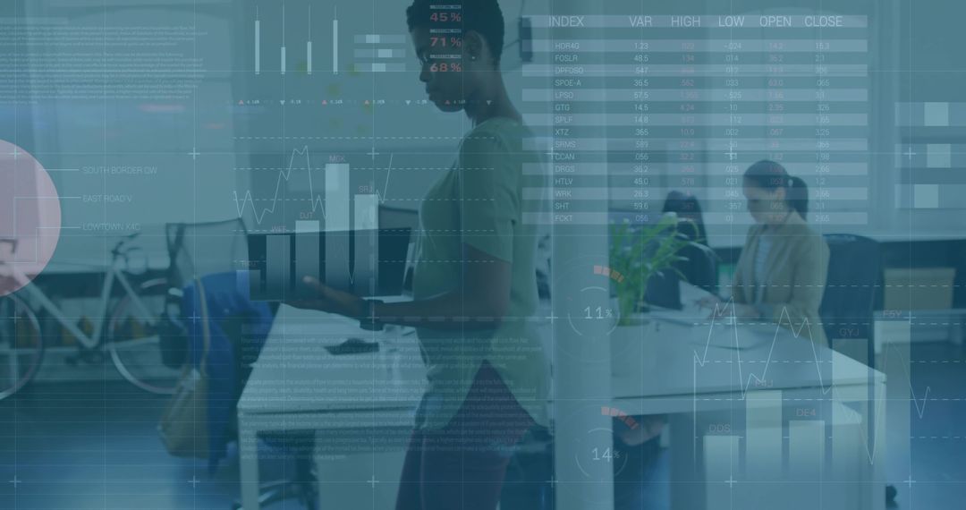 Woman Presenting Laptop in Modern Open Office Showing Analytics Dashboards and Charts