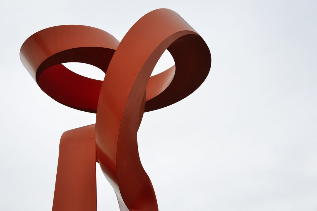 Large Red Abstract Metal Sculpture Against Sky - Free Images, Stock Photos and Pictures on Pikwizard.com