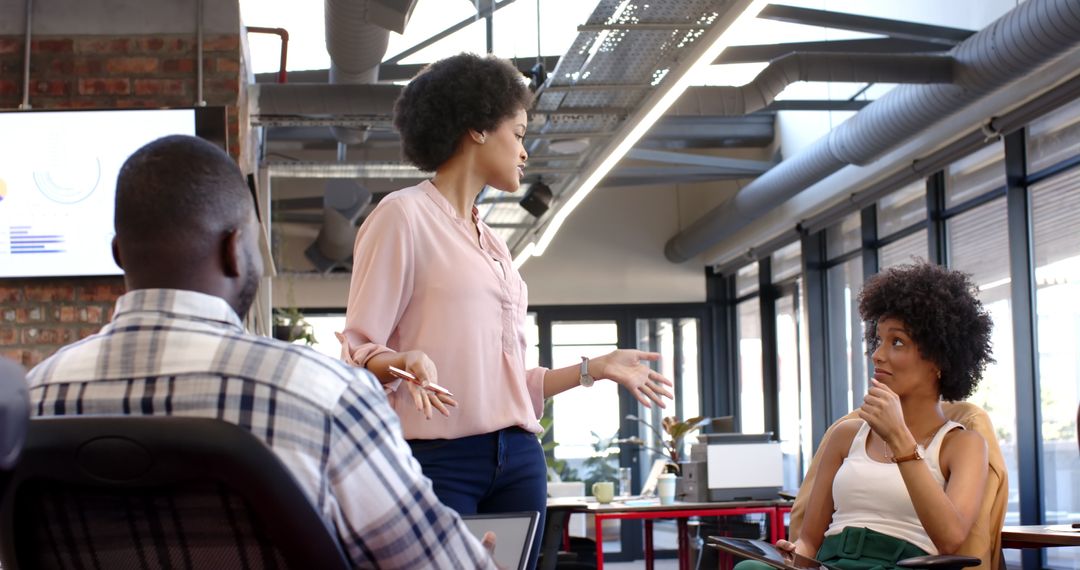 Diverse Team Brainstorming Ideas in Modern Startup Office