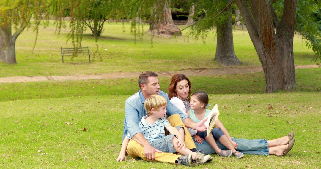 Happy Family Relaxing Outdoors in Park Under Trees - Free Images, Stock Photos and Pictures on Pikwizard.com