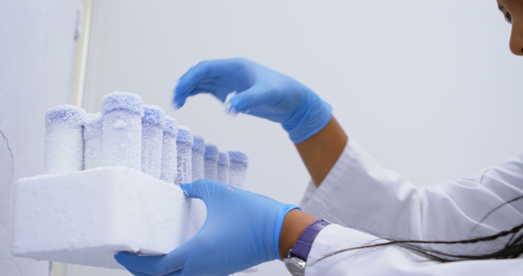 Lab Technician Handling Frozen Test Tubes in Scientific Laboratory - Free Images, Stock Photos and Pictures on Pikwizard.com