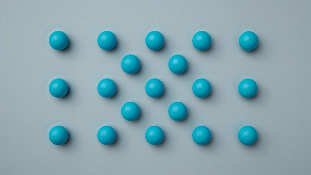 Geometric Pattern of Blue Spheres on Gray Surface