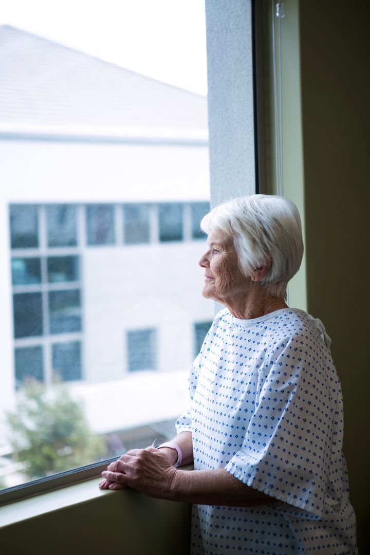 Senior patient standing at hospital - Free Images, Stock Photos and Pictures on Pikwizard.com