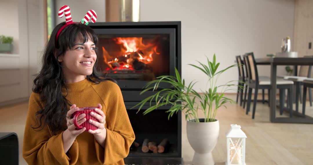 Woman Relaxing by Cozy Fireplace in Warm Rustic Home
