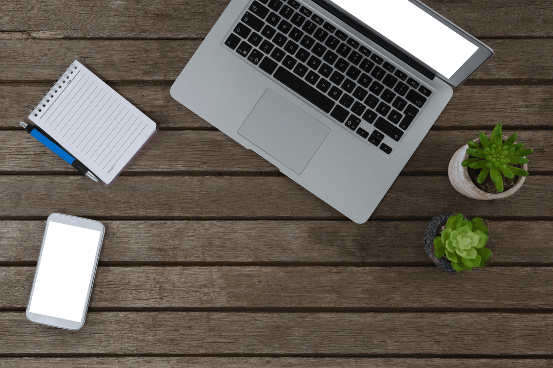 Transparent Screen Laptop and Mobile Phone on Wooden Desk with Plants