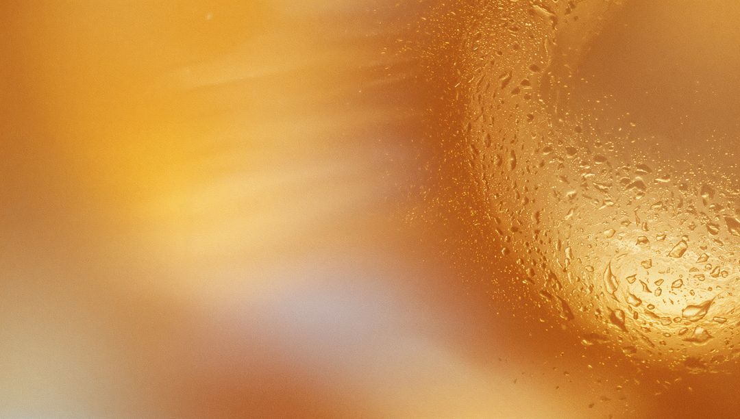 Ethereal Abstract Amber Glass Texture with Water Droplets