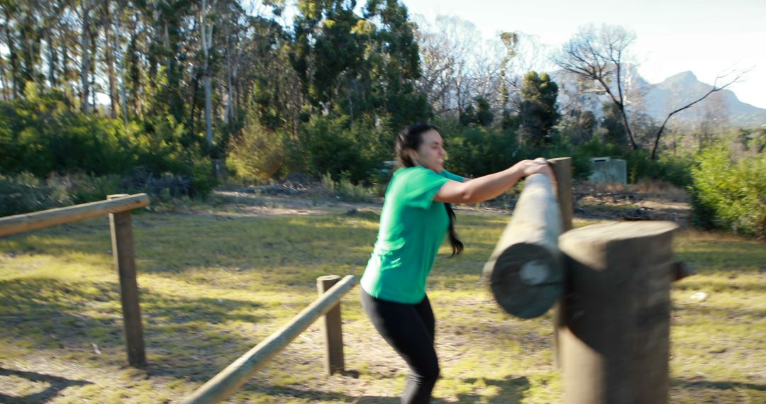 Woman Navigating Outdoor Obstacle Course in Nature - Free Images, Stock Photos and Pictures on Pikwizard.com