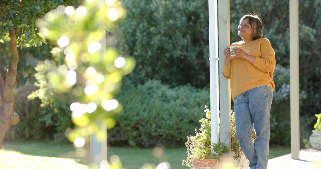 Middle-aged woman enjoying coffee outdoors - Free Images, Stock Photos and Pictures on Pikwizard.com