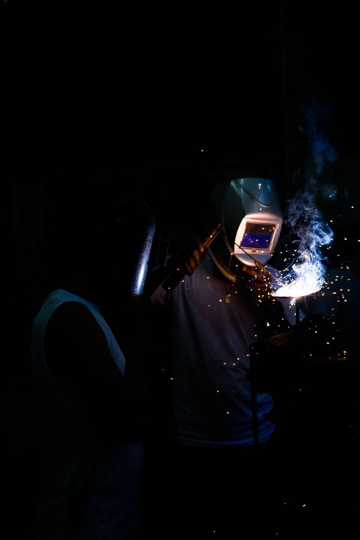 Industrial Welder Working with Protective Helmet and Gear - Free Images, Stock Photos and Pictures on Pikwizard.com