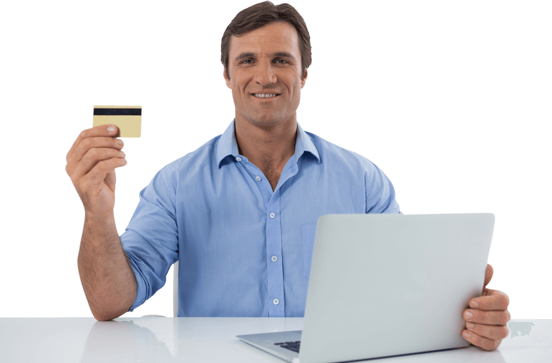 Man in Blue Shirt Enjoying Online Shopping with Credit Card and Laptop