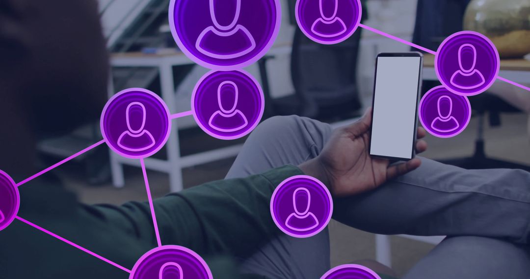 Man Exploring Digital Network on Smartphone in Modern Office Lounge