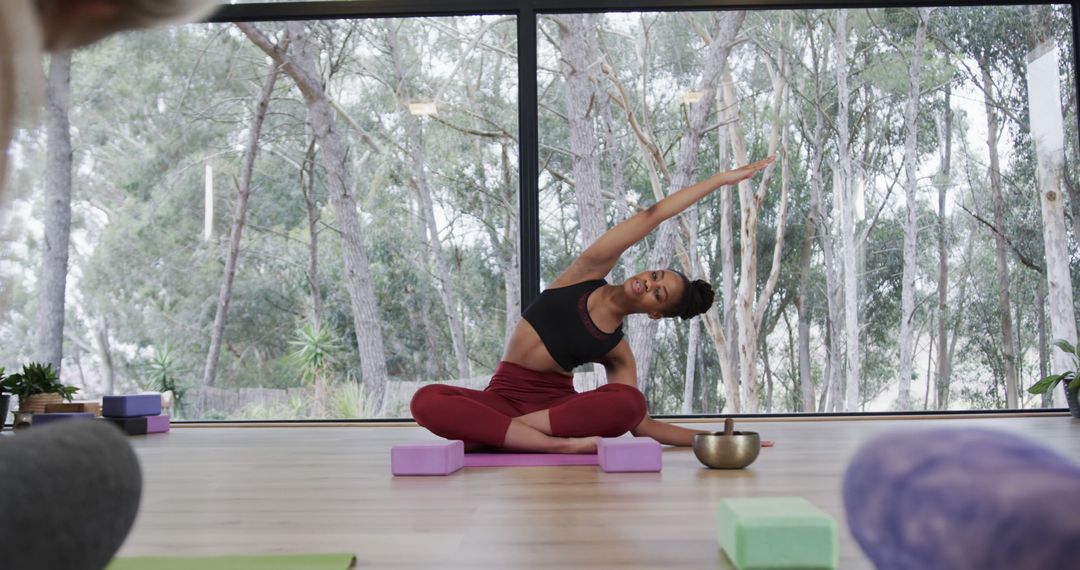 Woman Practicing Yoga Indoors with Large Window View - Free Images, Stock Photos and Pictures on Pikwizard.com