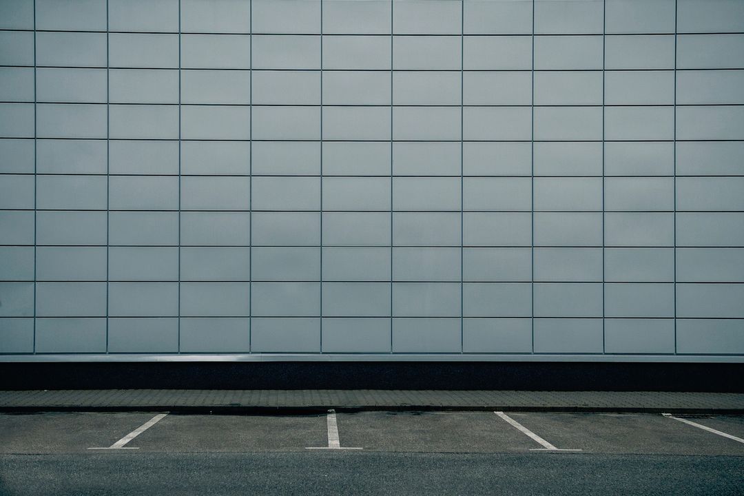 Modern Minimalist Exterior Wall with Empty Parking Spaces
