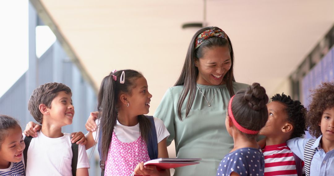 Smiling Teacher Engages Diverse Students in Educational Environment