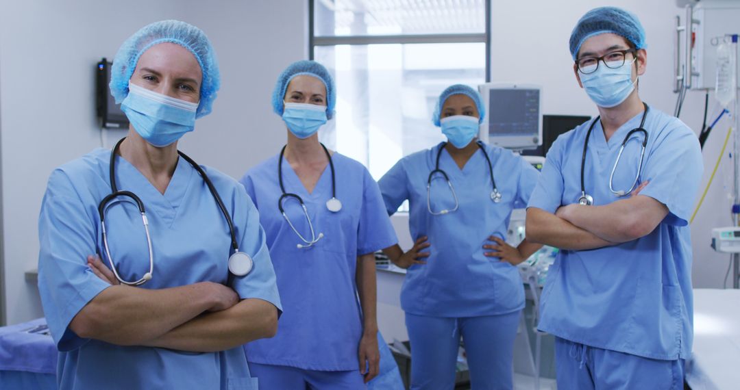 Portrait of diverse female and male surgeons wearing face masks and scrubs in hospital - Free Images, Stock Photos and Pictures on Pikwizard.com