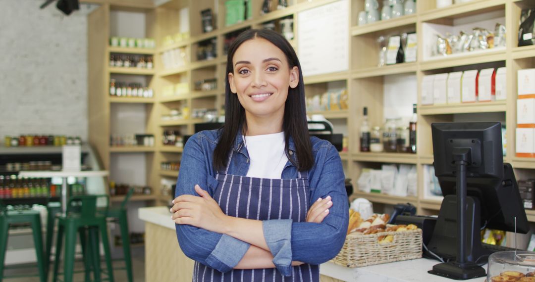 Image of happy biracial waitress standing in coffee shop - Free Images, Stock Photos and Pictures on Pikwizard.com