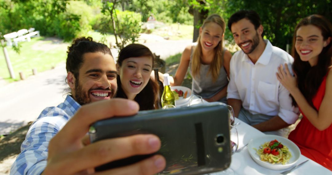 Friends Taking Selfie During Lunch at Outdoor Restaurant - Free Images, Stock Photos and Pictures on Pikwizard.com